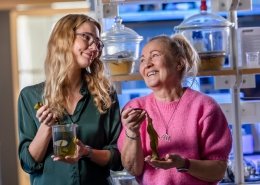 Linn Berglund and Kristiina Oksman share a smile in the hydrogel development laboratory, with kelp on display. Photo by courtesy of Kristiina Oksman.