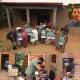 Participants at a workshop in Rusagara village, Rwanda, in July 2024, where results from one of the studies included in García-López’s doctoral thesis were presented to local households (top, photo: Natxo García-López). A portrait of García-López is shown in the upper right corner (photo: Umeå University). The instrumental setup developed at Umeå University for experimental work in rural Rwanda is displayed on the left (photo: Natxo García-López). In the middle, García-López is preparing portable instrumentation (micro-aethalometer) for field measurements (photo: Sabine Ingabire). On the right, an improved rocket stove, fueled with sticks, is shown in operation during field measurements (photo: Natxo García-López).
